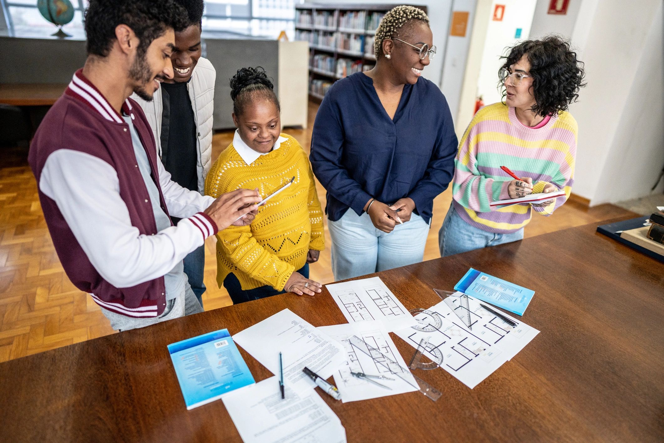 Community members collaborating in a library meeting