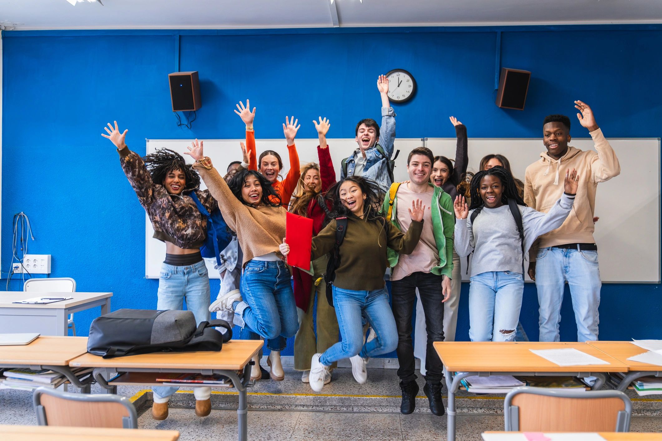 Students celebrating together in a classroom