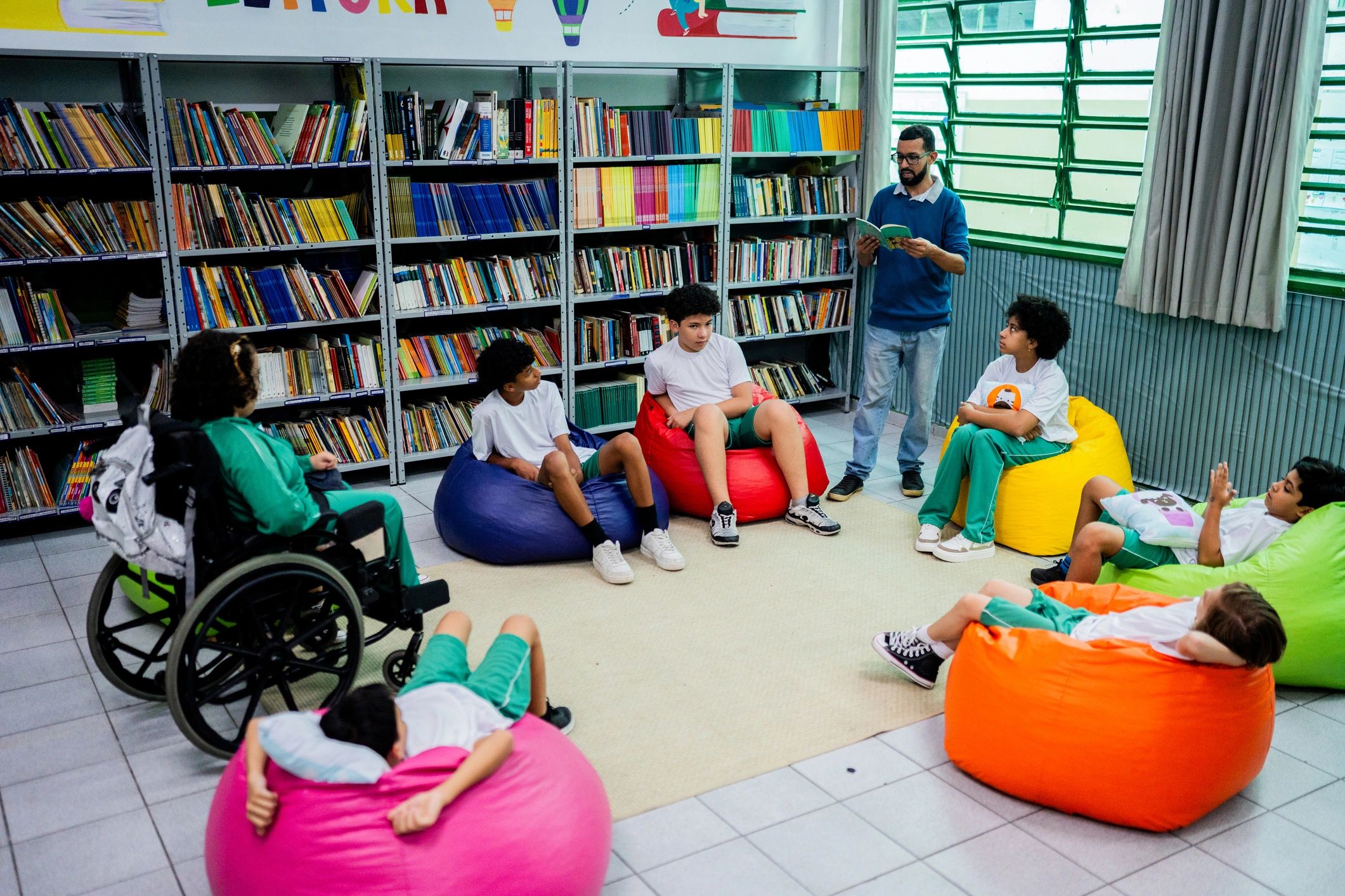 Inclusive school community reading together in a library