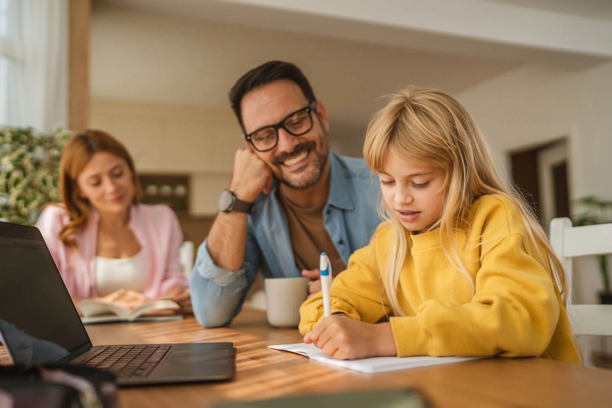 Parents helping a child with homework